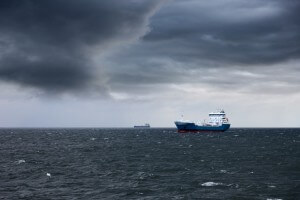 ship at sea under stormy skies