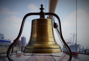 old ship sailing bell on deck of a large boat